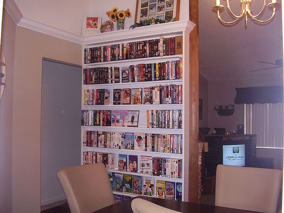 Dining Room Accented with Book Shelf