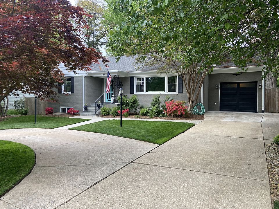 Front with Attached Garage and Extra Parking