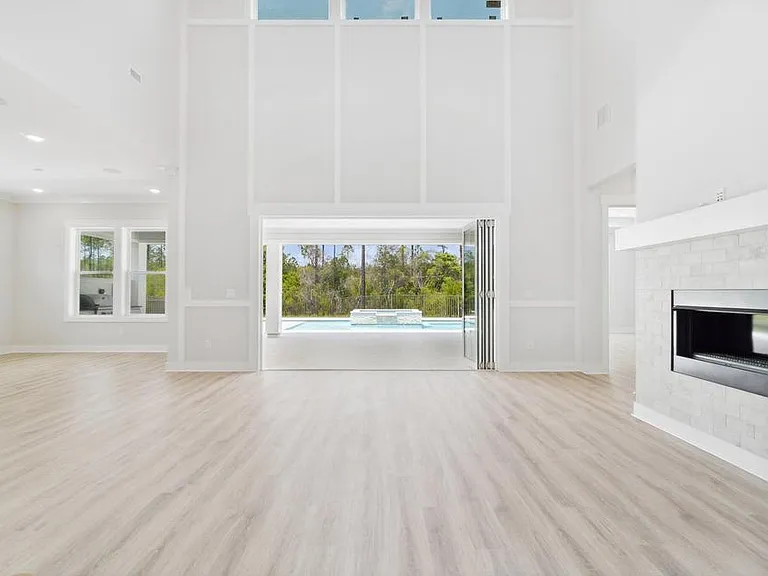 Downstairs living room opens into 612 foot covered and screened in Lanai.