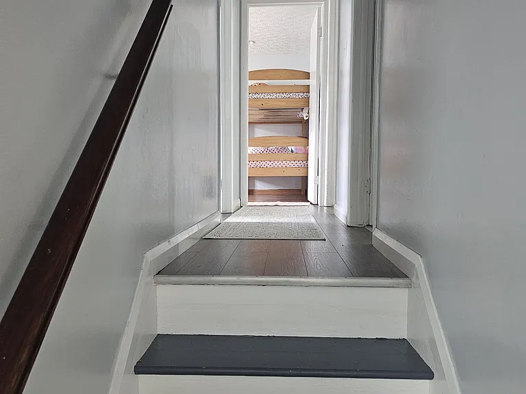 living room facing upper floor hallway