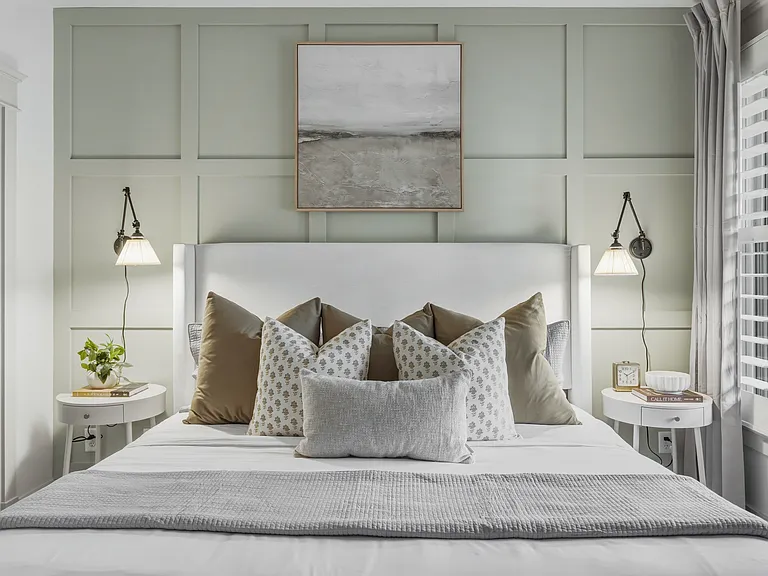 King sized bed in bedroom 2, featuring a walk-in closet, dresser, smart TV, full-length mirror, and ensuite bathroom.
