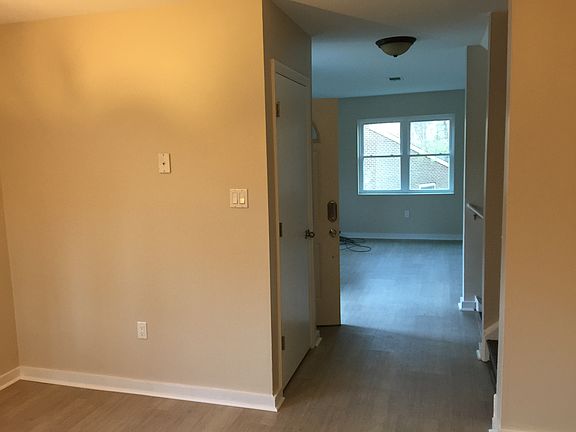 Front entryway looking from kitchen into living room on main