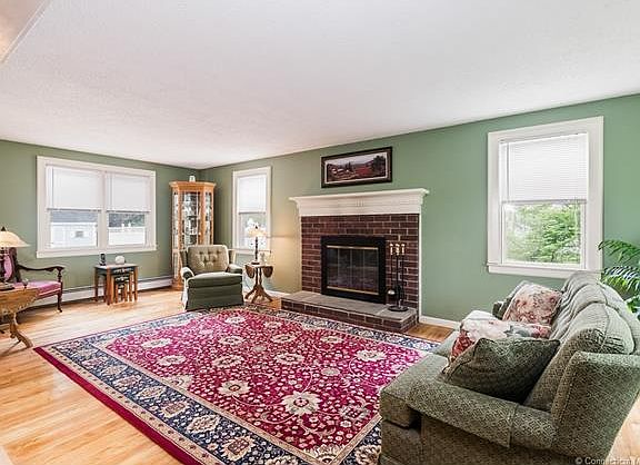 Formal living room with fir...