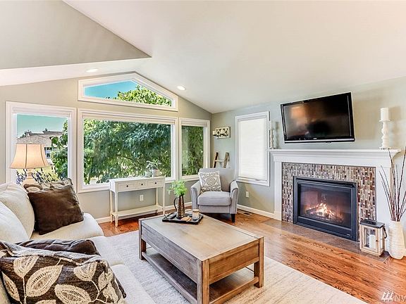 Soaring ceilings and expansive windows illuminate this beautiful home's interior.