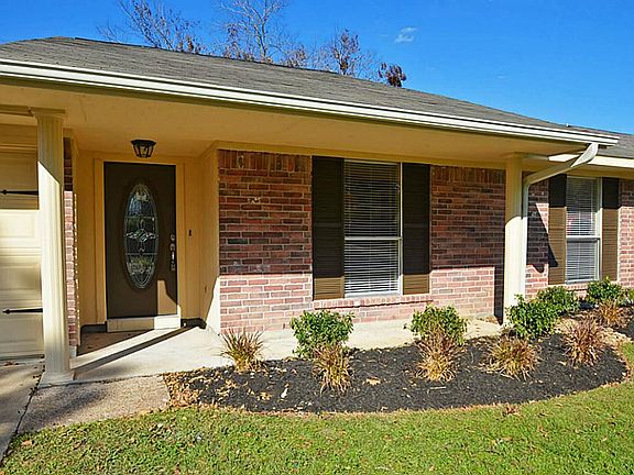 The flowerbeds enhance the great curb appeal!
