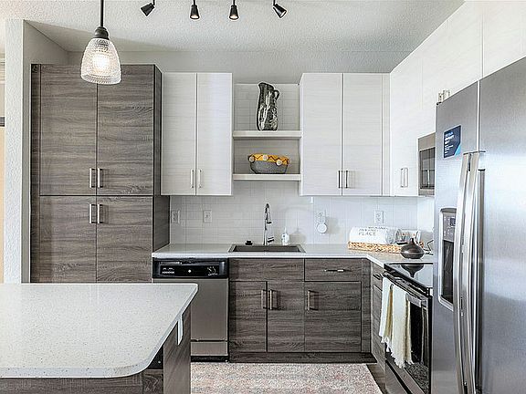 Experience culinary luxury in this contemporary kitchen, featuring high-end finishes and ample storage.