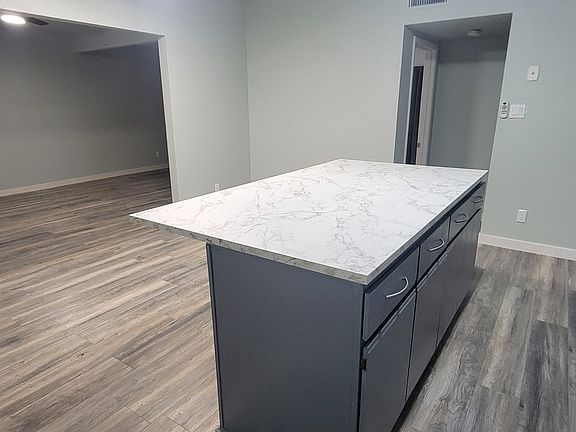 Kitchen - you can see entry into the living room and that there is a dishwasher and full-size refrigerator.