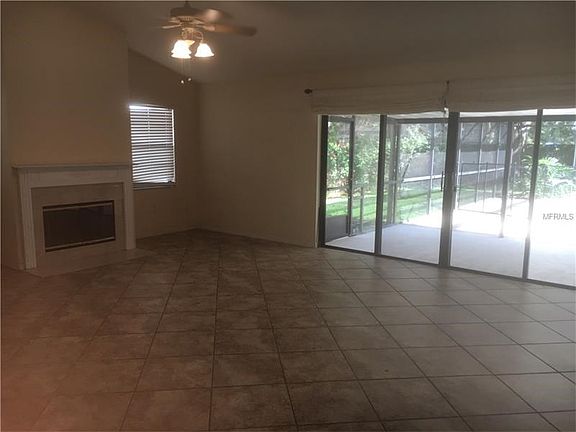 FAMILY ROOM WITH WOOD BURNING FIREPLACE AND FANTASTIC POOL VIEW!