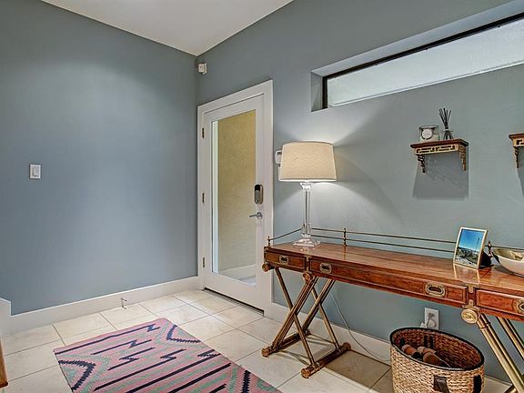 Step into this inviting home and notice the charm and elegance. Beautiful door leads you to the entryway/mud room with ceramic tile floor and recessed lighting. Elevated narrow window lets light in while allowing privacy