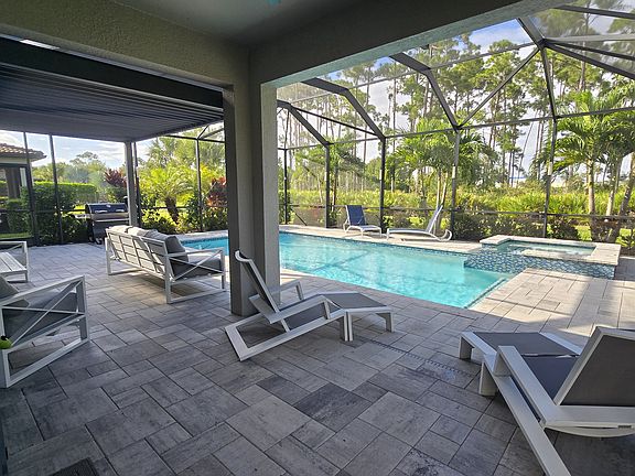 Ample entertainment space with covered lanai + adjustable pergola.