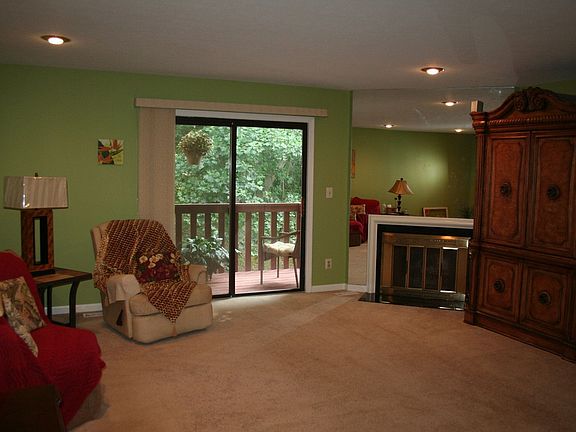 Spacious, yet cozy living room with wood burning fireplace