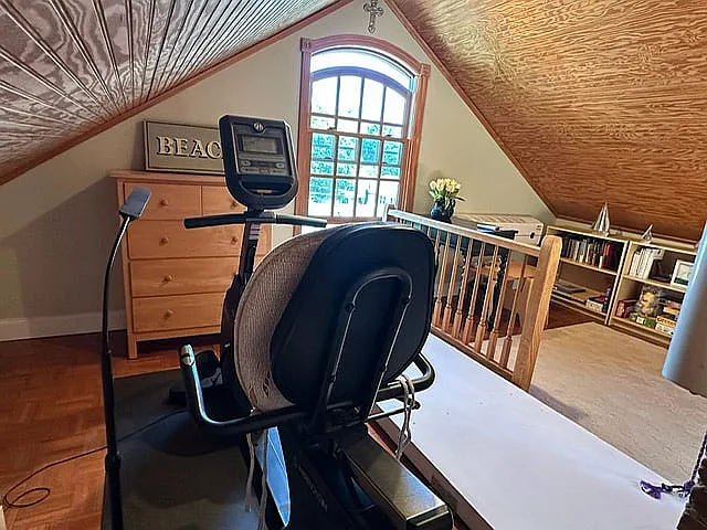 The recumbent bike allows one to stay fit no matter the weather--and what a view out the arched window! Space to stretch, too.