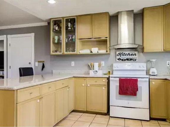 Granite countertops and new appliances make this kitchen a hub for warm family gatherings
