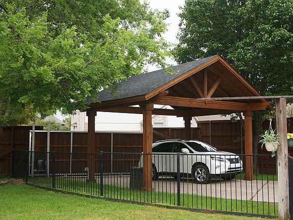 Carport which has space for 2 vehicles. Excellent in summer time.