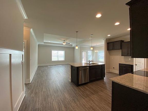 Plenty of windows with custom blinds. (Fridge included, not shown in this photo)