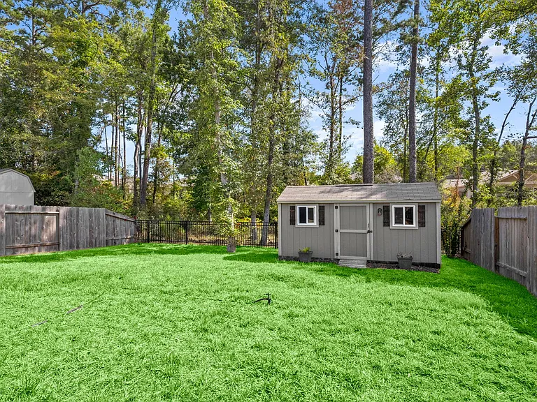 HUGE BACKYARD WITH STORAGE SHED!