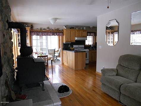 View of Living Room to Dining & Kitchen