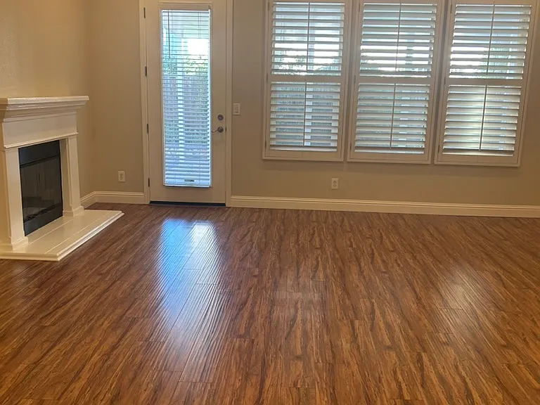 Family Room with fireplace, freshly painted interiors