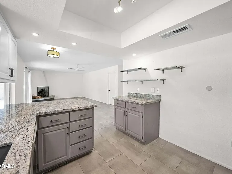 Fabulous granite countertops. Kitchen over-looks beautiful backyard.