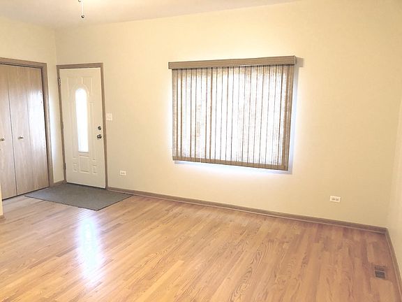 Hardwood floors in living room with plenty of room for entertaining