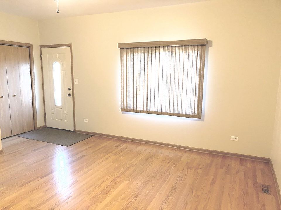 Hardwood floors in living room with plenty of room for entertaining