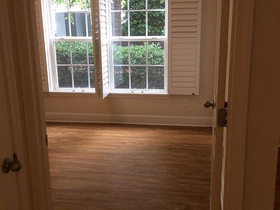 Bedroom with wood plank flooring