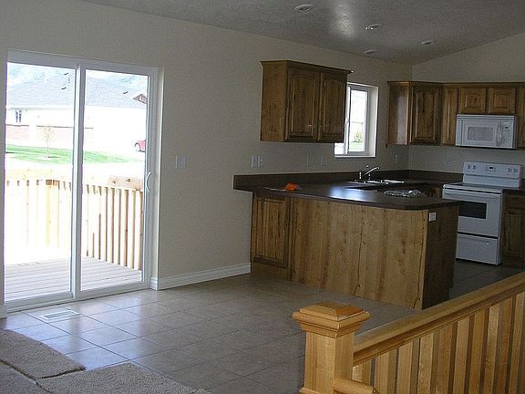 Large kitchen and dining area laudry room is beside kitchen