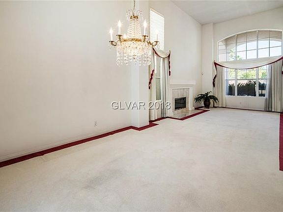 Beautiful Chandelier in Formal Dining Room. Huge Picture Windows..Formal Living and Dining Rooms