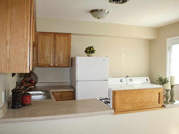 Kitchen with full size washer and dryer