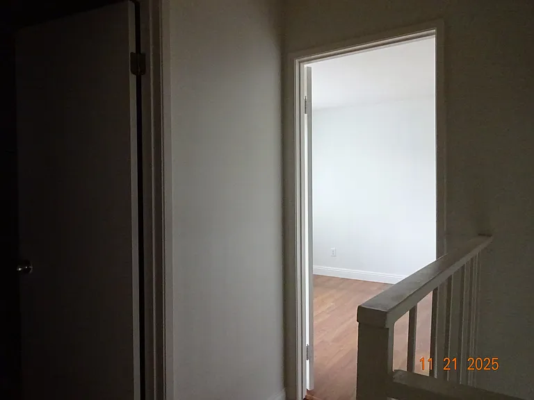 hallway out of full bathroom and to 2 bedroom