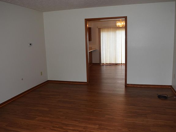 The spacious living room will accommodate a couch, love seat, chair, tables and TV. The new flooring is quiet and easy to clean.