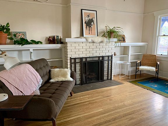 Twin+ futon. AC unit above. Ceiling fan.