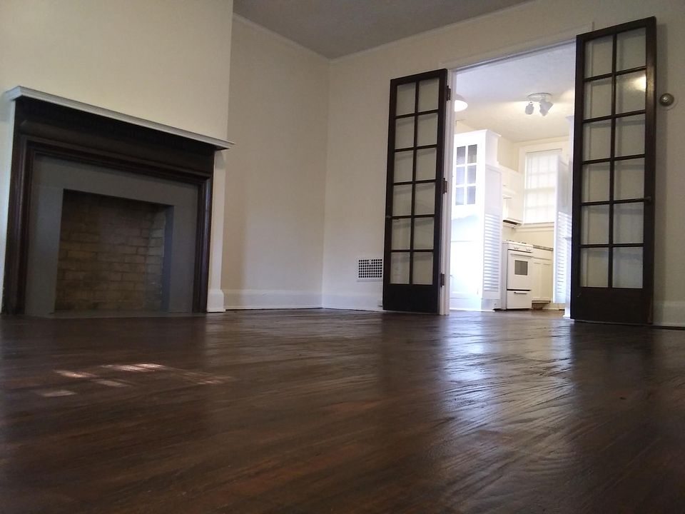 Living room/bedroom. Newly re-finished hardwood floors throughout apartment.