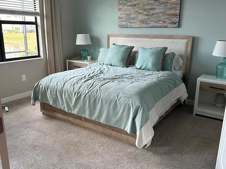 Gorgeous master bedroom with view of lake.