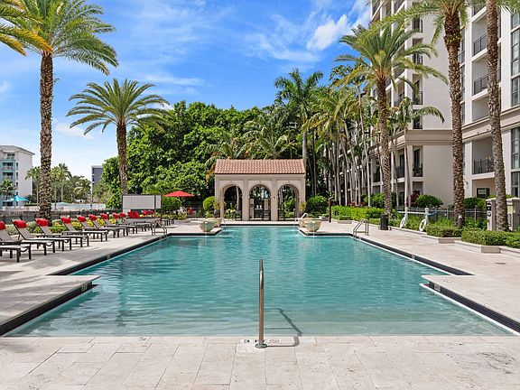 Palm-lined pool views create the perfect setting for relaxation