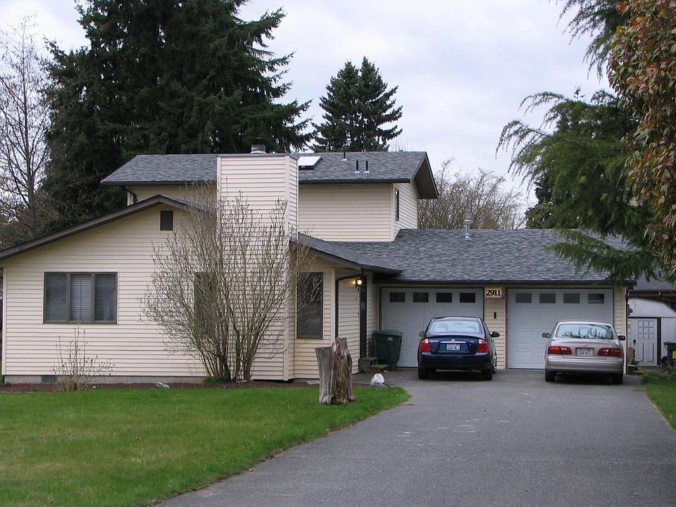 Exterior with garage and ample parking