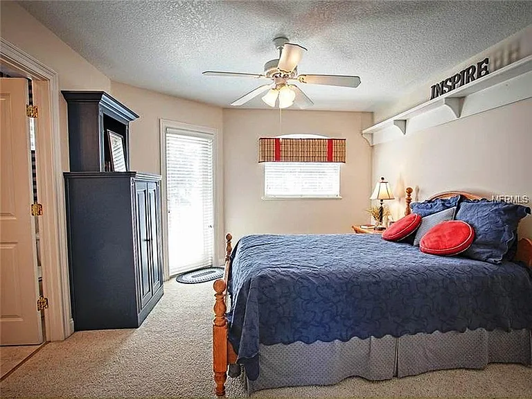 This is another of the upstairs BRs with the door that leads out on the upper deck overlooking the lake with spectacular views. These BRs have walk in closets and craft rooms.