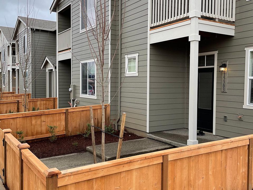 Front green patch + entrance . HOA maintains the front yard including fence