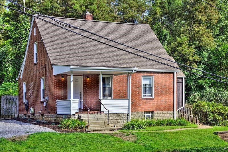 Exterior Front.  Driveway is to the left of the house.