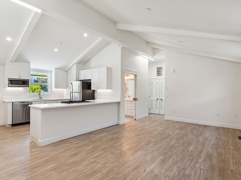 Main living space and Kitchen, with vaulted ceilings