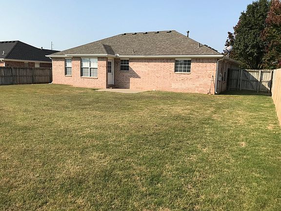 Large fenced in backyard with 2 gates.