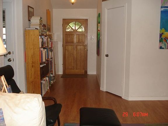 View of laminated flooring and foyer