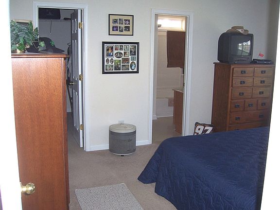 Master bedroom with walk in closet and master bath