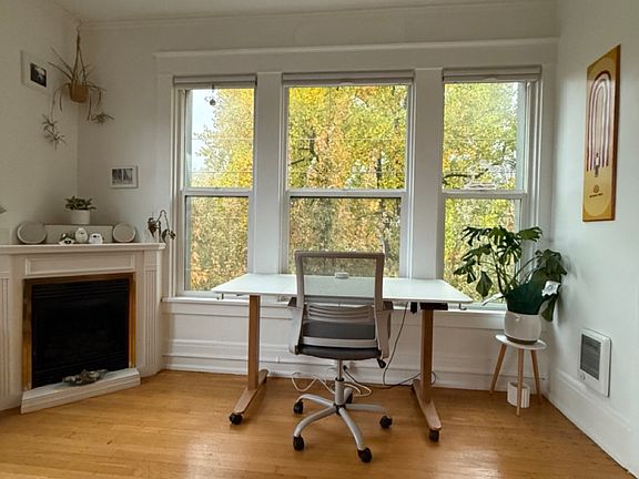 Electric adjustable/standing desk on caster wheels. Functioning gas fireplace