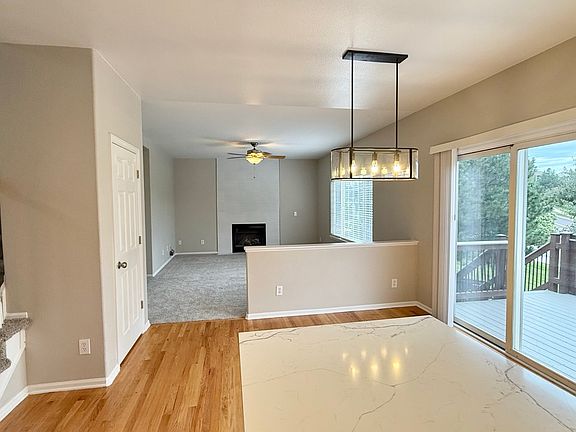 Family room w/ fireplace and Dining area