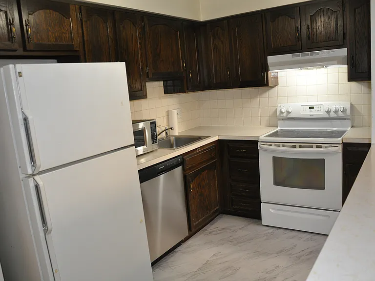 Kitchen with new flooring and new dishwasher