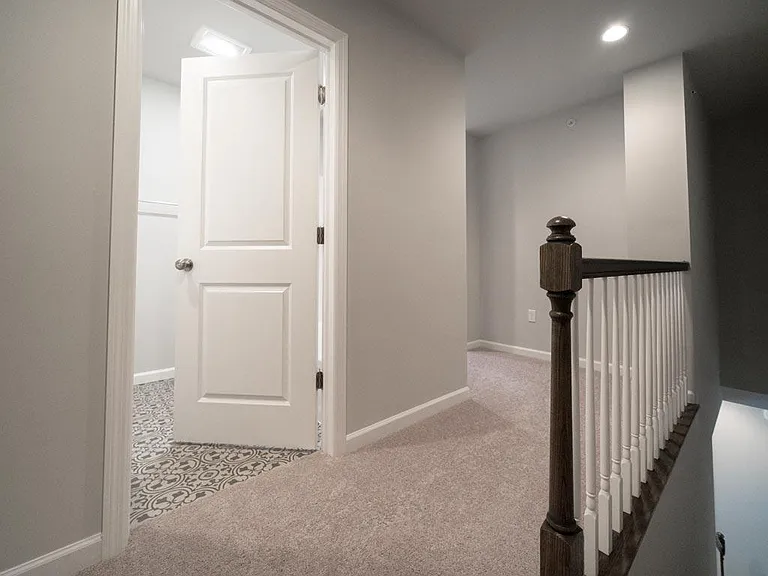 hall bath entrance with tub and shower