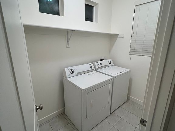 Laundry room includes washer and dryer.