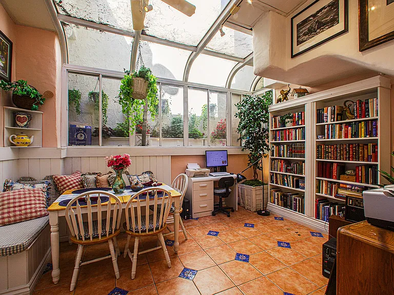 View from the kitchen into the vaulted atrium skylight. Enjoy your morning's coffee at the breakfast nook. Ivy wall was added after this photo!
