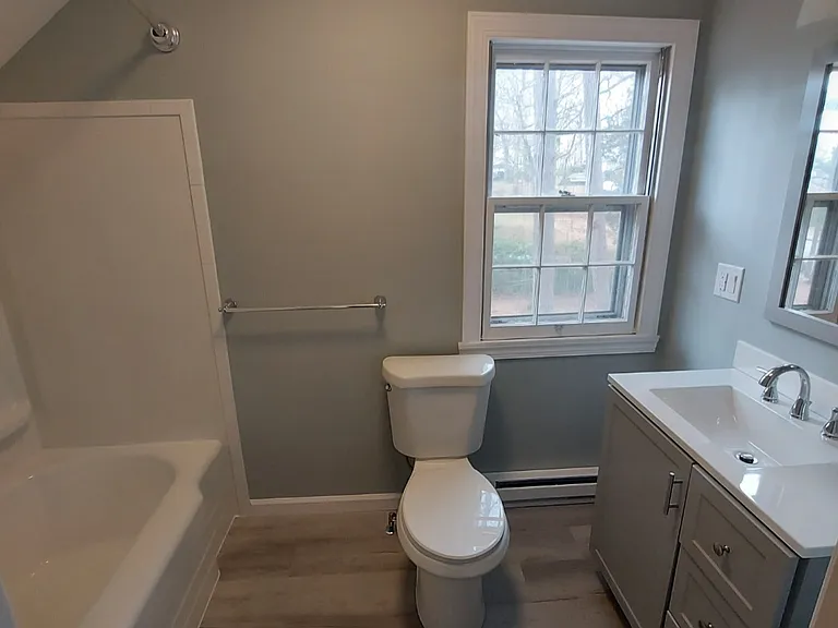 Upstairs bathroom with tub